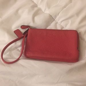 used coach leather pink clutch